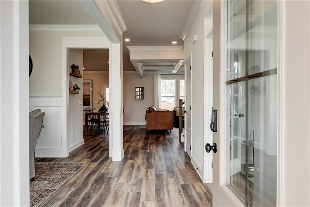 15 Cardinal Rdg Court Winder, GA 30680 - Photo 11 of 86 a view of a hallway with wooden floor and a living room