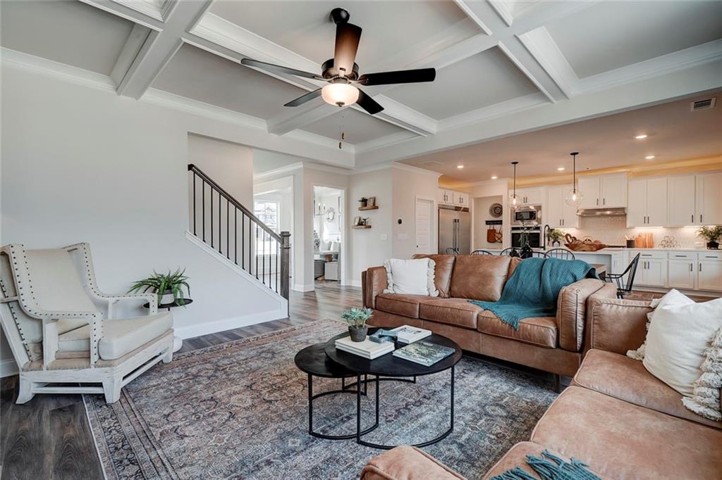 15 Cardinal Rdg Court Winder, GA 30680 - Photo 13 of 86 a living room with furniture kitchen view and a chandelier