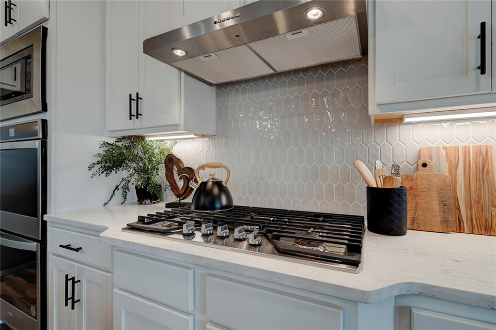15 Cardinal Rdg Court Winder, GA 30680 - Photo 17 of 86 a kitchen with a stove and a refrigerator