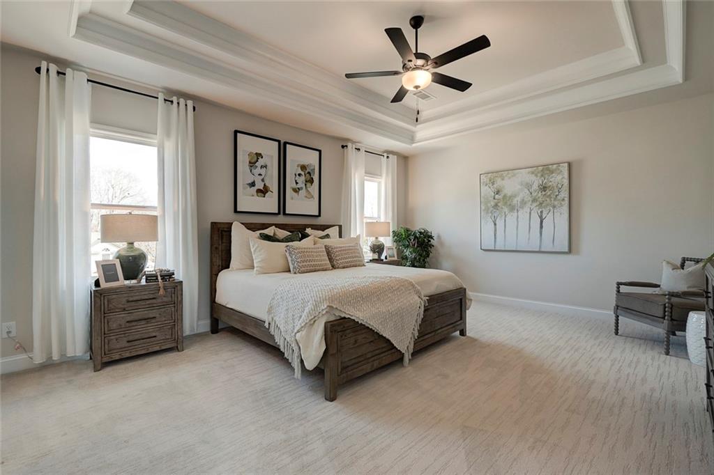 15 Cardinal Rdg Court Winder, GA 30680 - Photo 30 of 86 a spacious bedroom with a bed painting on wall and a large window