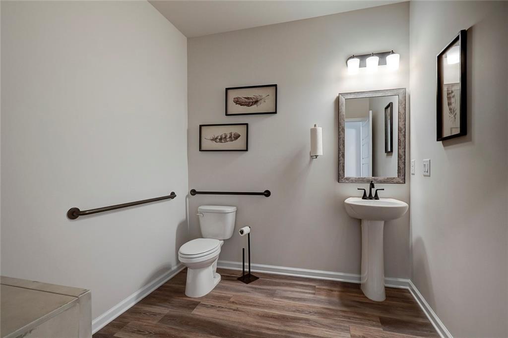 15 Cardinal Rdg Court Winder, GA 30680 - Photo 3 of 86 a bathroom with a toilet a sink and mirror