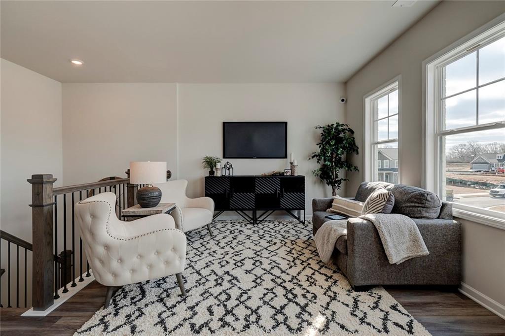15 Cardinal Rdg Court Winder, GA 30680 - Photo 31 of 86 a living room with furniture and a flat screen tv