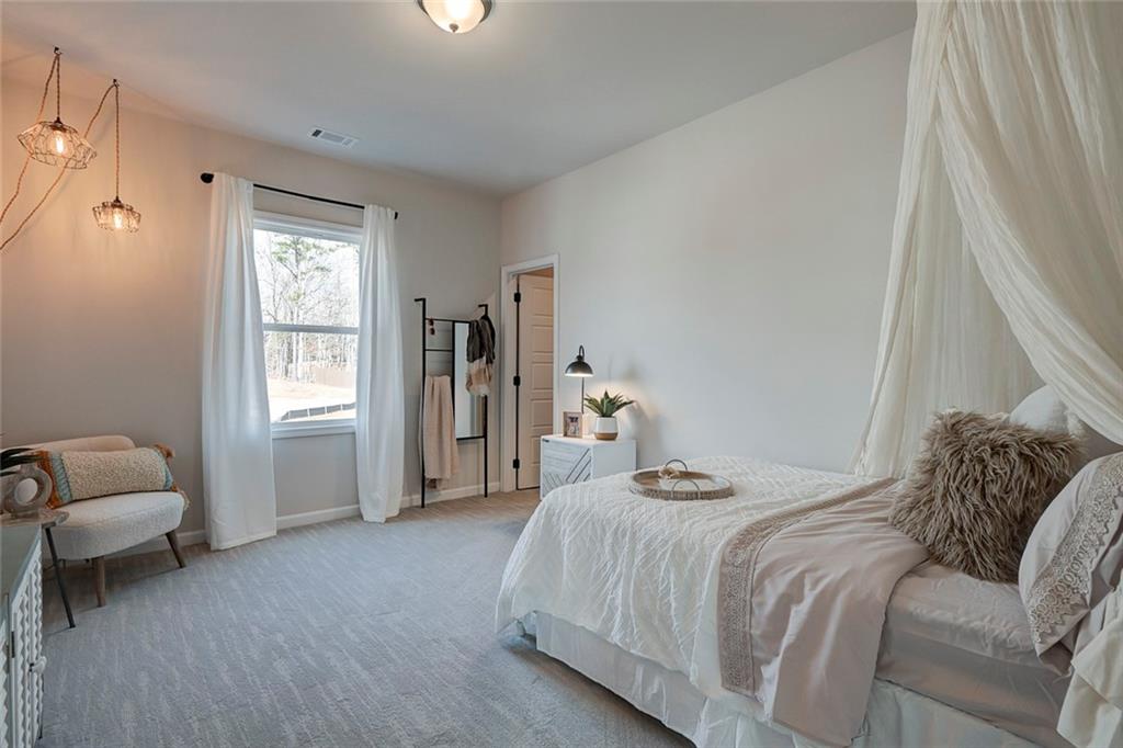 15 Cardinal Rdg Court Winder, GA 30680 - Photo 5 of 86 a bedroom with a bed and a window