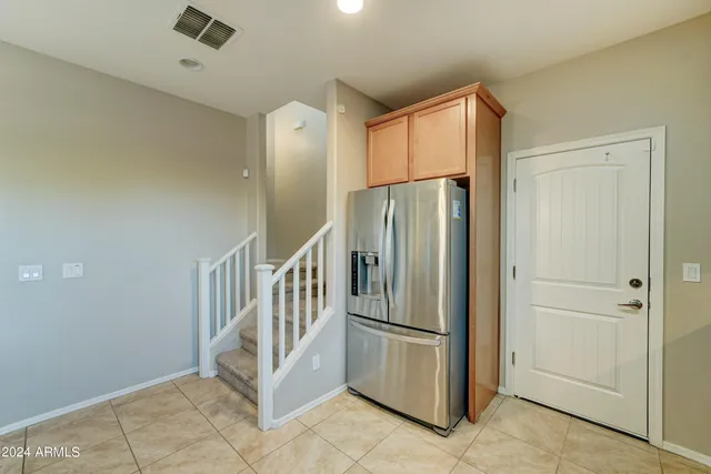 a view of a hallway with entryway door