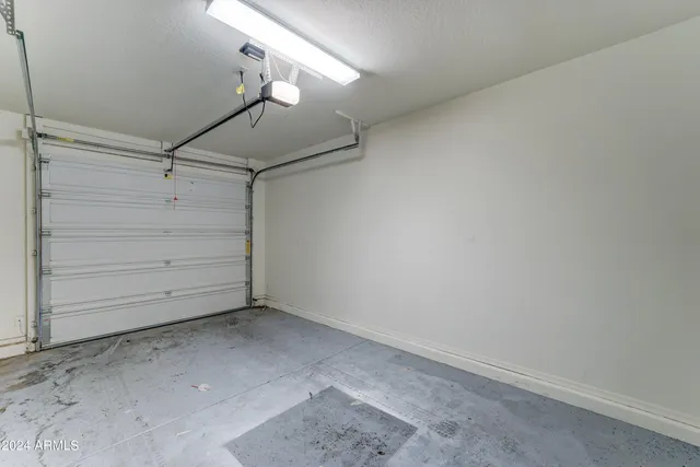 an empty room with a ceiling fan