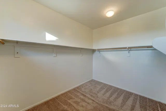 a view of a room with shelf on the wall