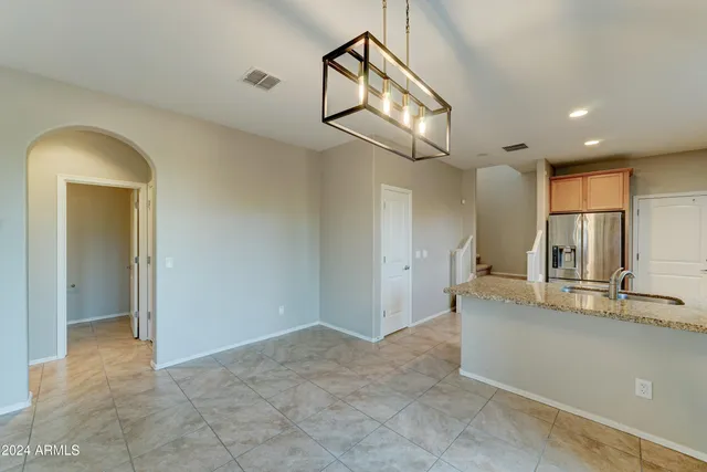 a view of a kitchen with a sink and a wooden floor