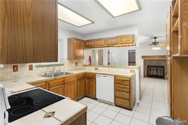 a kitchen with a sink stove and cabinets