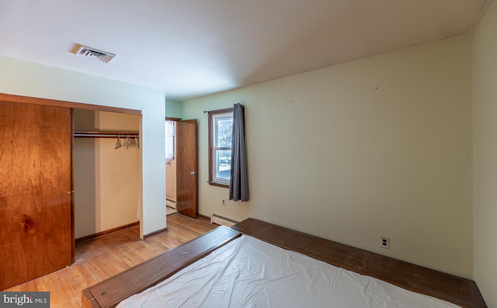 948 Quarry Road Gap, PA 17527 - Photo 16 of 34 a view of a room with wooden floor and windows