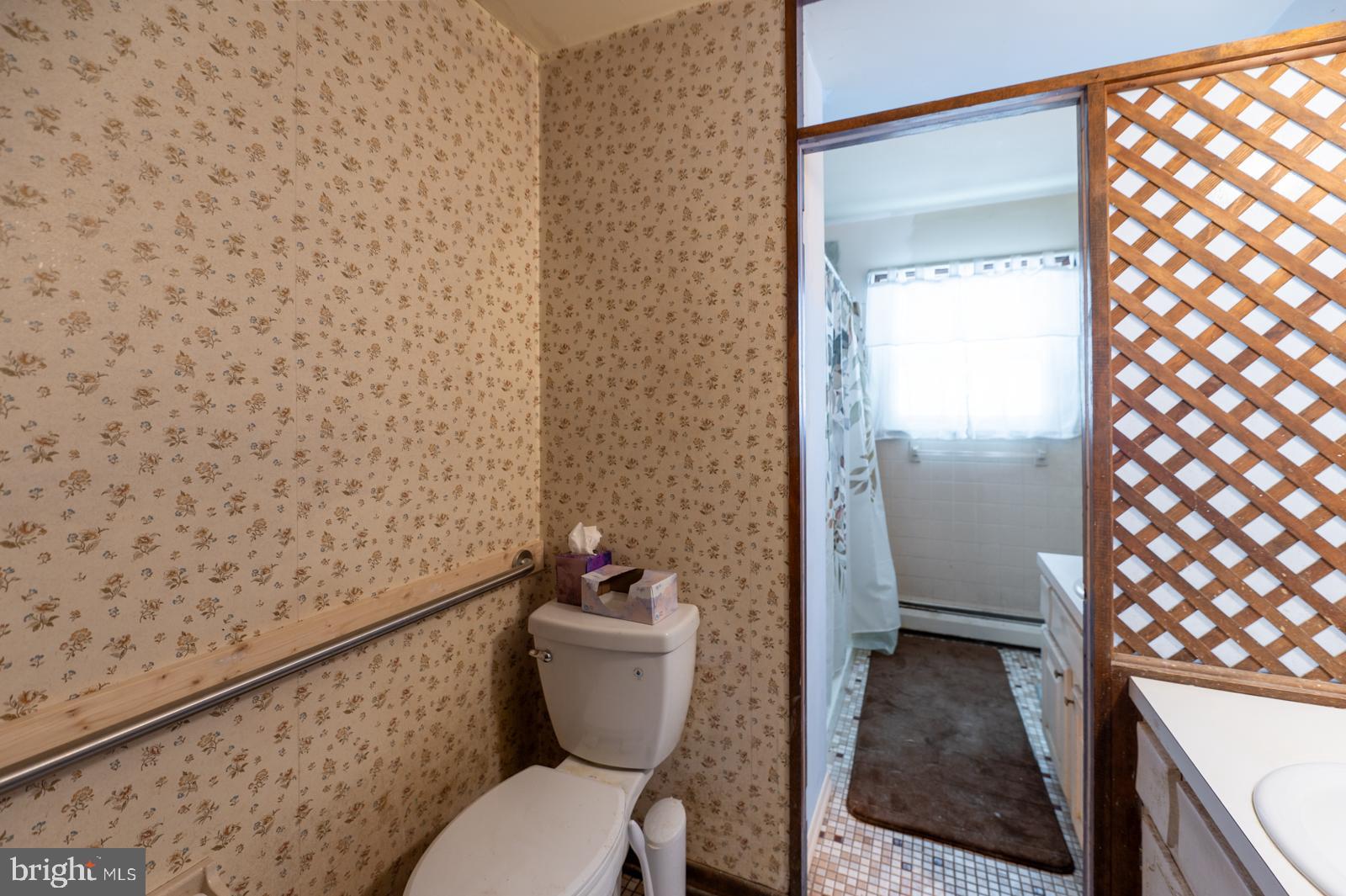 948 Quarry Road Gap, PA 17527 - Photo 20 of 34 a bathroom with a toilet and a shower curtain
