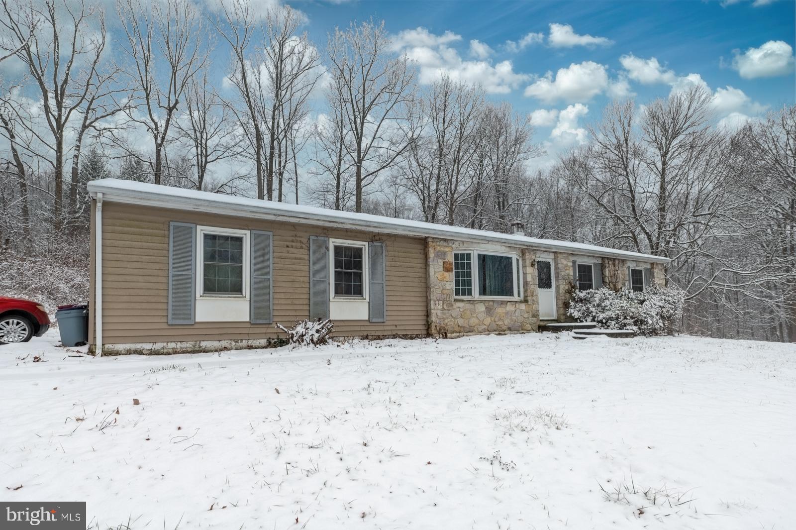948 Quarry Road Gap, PA 17527 - Photo 3 of 34 a front view of a house with a yard covered in snow