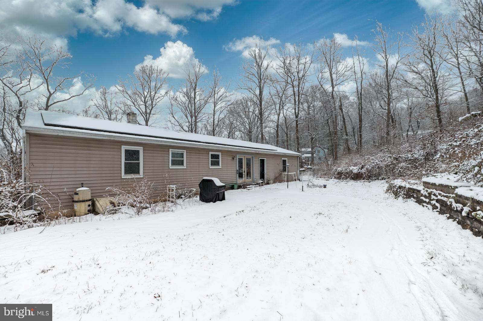 948 Quarry Road Gap, PA 17527 - Photo 32 of 34 a view of a house with a yard covered in snow
