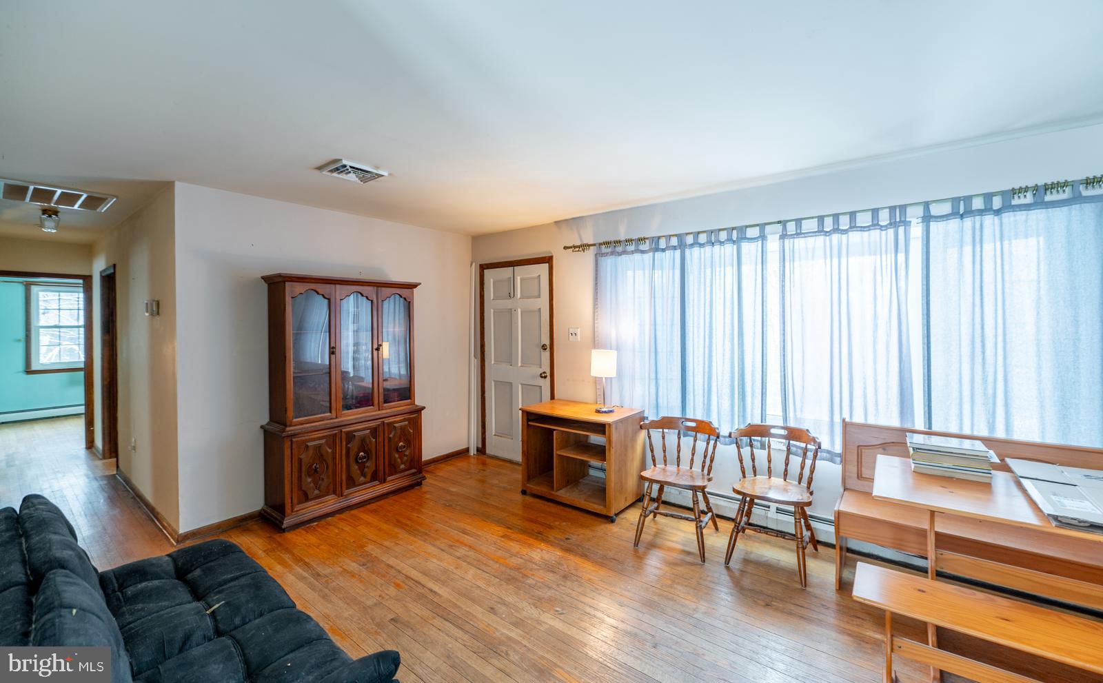 948 Quarry Road Gap, PA 17527 - Photo 5 of 34 a living room with furniture and a wooden floor