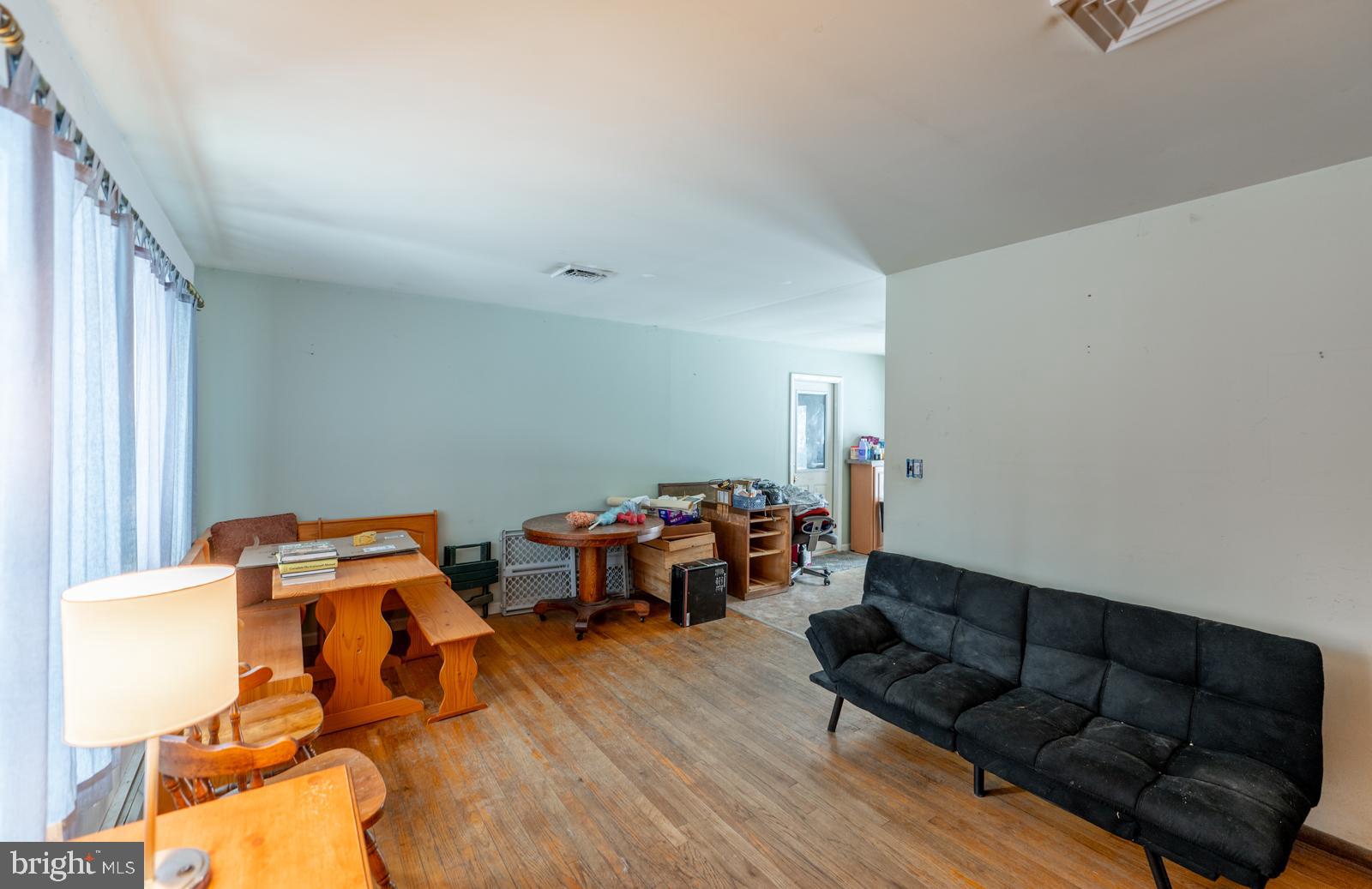 948 Quarry Road Gap, PA 17527 - Photo 7 of 34 a living room with furniture and a wooden floor