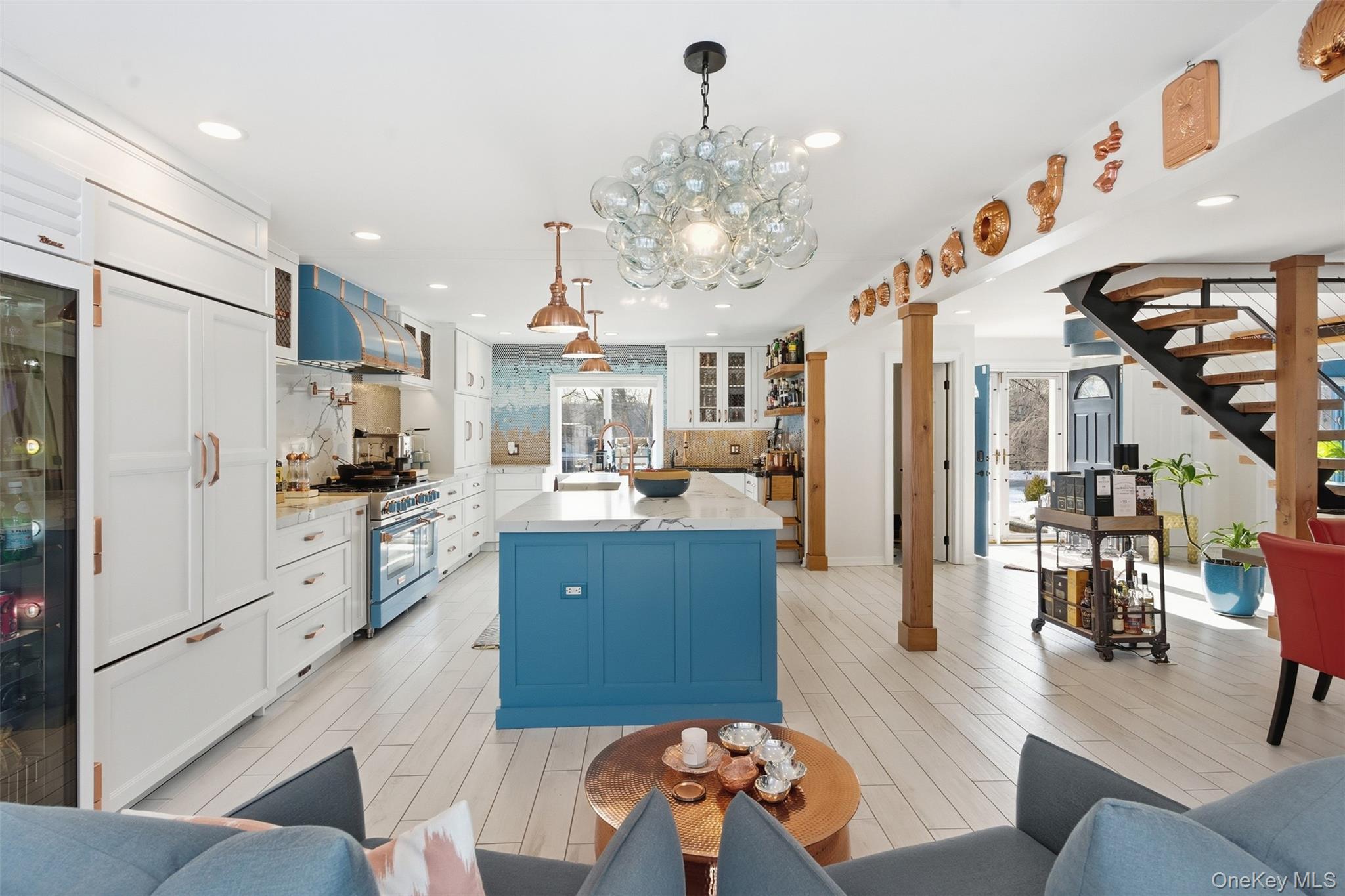 134 Fostertown Road Newburgh, NY 12550 - Photo 12 of 50 a kitchen with stainless steel appliances kitchen island granite countertop a refrigerator a stove a sink dishwasher and white cabinets with wooden floor