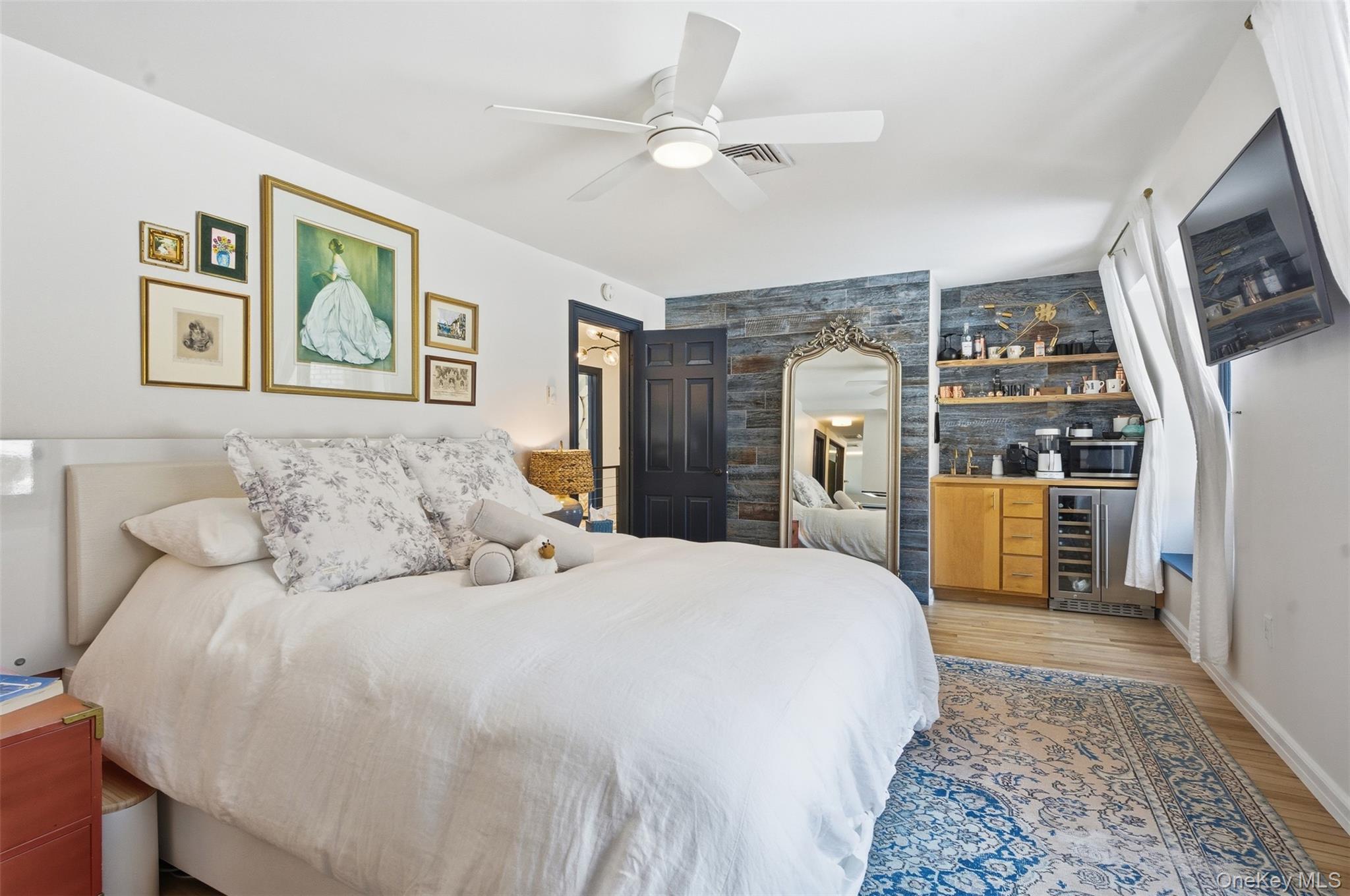 134 Fostertown Road Newburgh, NY 12550 - Photo 24 of 50 a bedroom with a large bed a flat tv screen and dresser