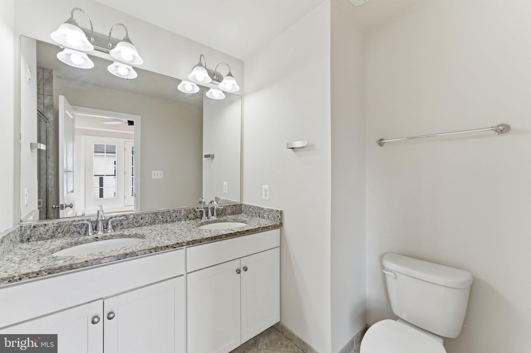 169 Kandinsky Loop Silver Spring, MD 20906 - Photo 51 of 67 Sleek modern bathroom with dual sinks.