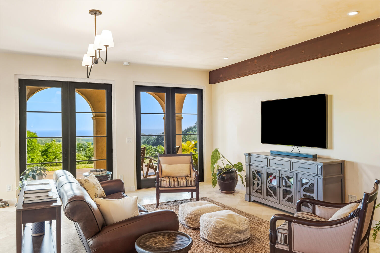4114 Waha Road, Unit J Kalaheo, HI 96741 - Photo 16 of 30 a living room with furniture a fireplace and a flat screen tv