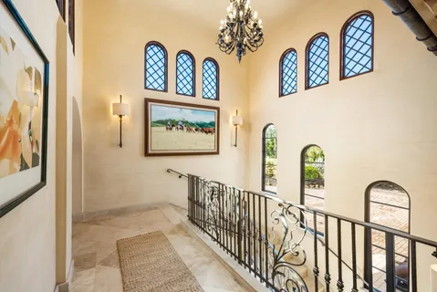 a view of a hallway with windows