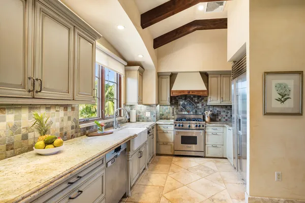 a kitchen with stainless steel appliances granite countertop a stove and a sink