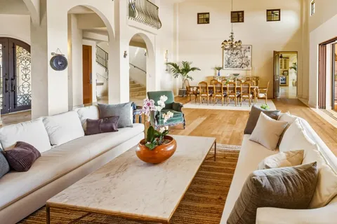 a living room with furniture and view of living room