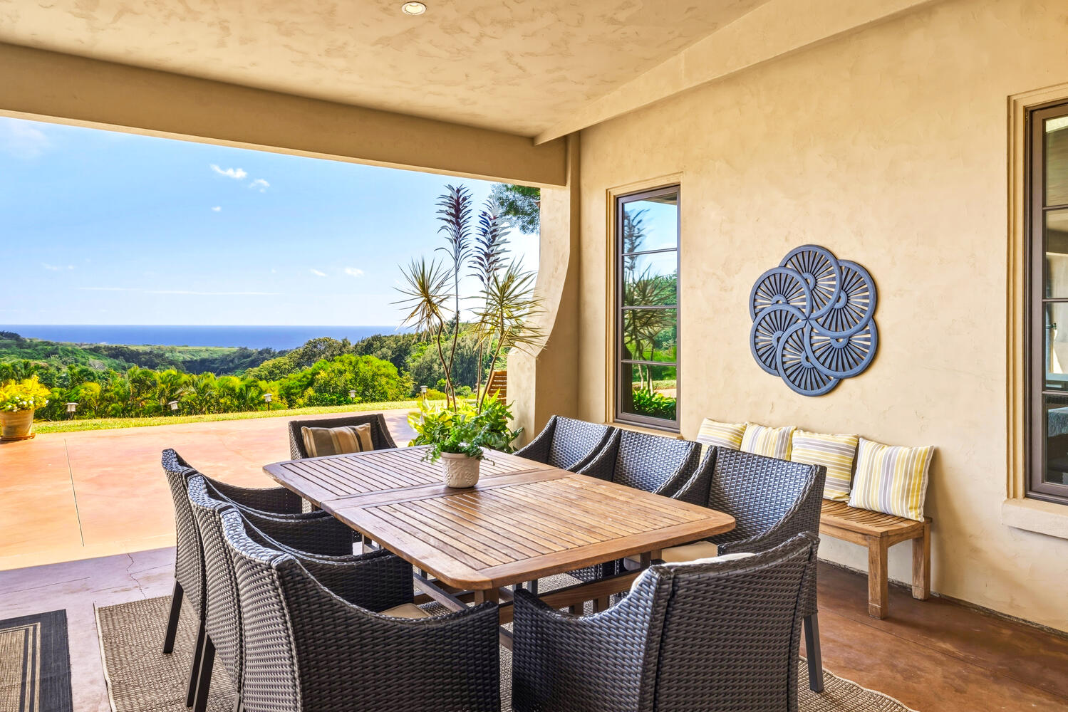 4114 Waha Road, Unit J Kalaheo, HI 96741 - Photo 7 of 30 a view of a dining room with furniture a rug and wooden floor