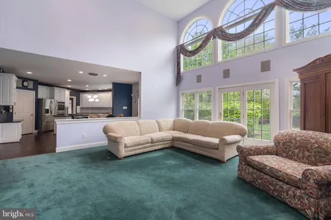 a living room with furniture fireplace and flat screen tv