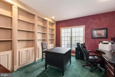 a workspace with furniture and window