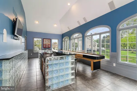 a large kitchen with stainless steel appliances granite countertop a large stove a sink and a refrigerator