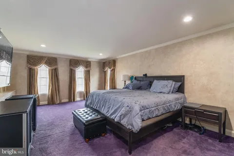 a spacious bathroom with a tub sink shower and mirror