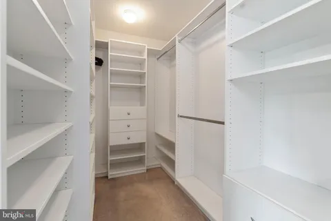 a bathroom with a shower sink vanity mirror and toilet