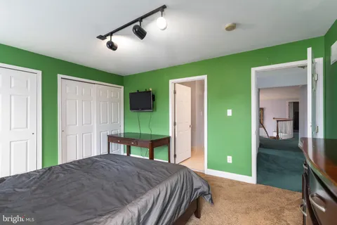 a room with furniture and pool table