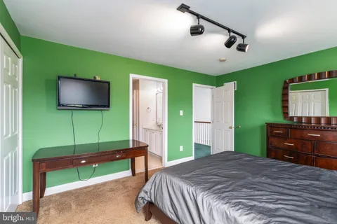 a media room with lots of chairs and a projector screen