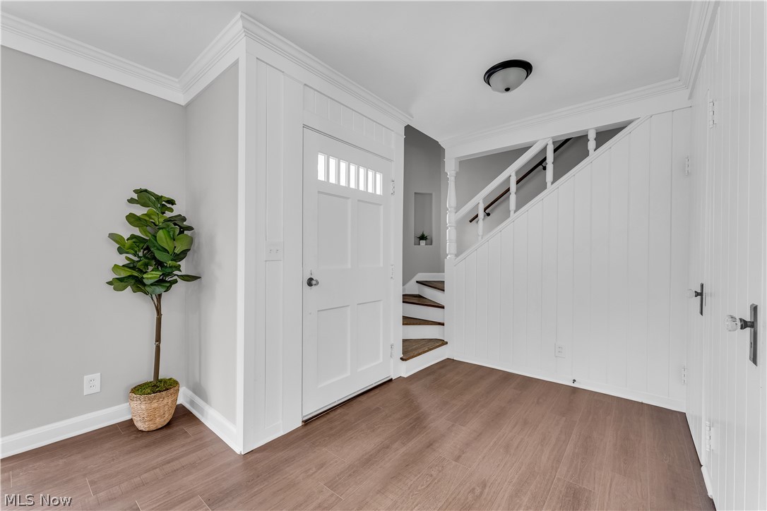 1539 Sunview Road Cleveland, OH 44124 - Photo 18 of 38 Foyer entrance featuring ornamental molding and wood-type flooring