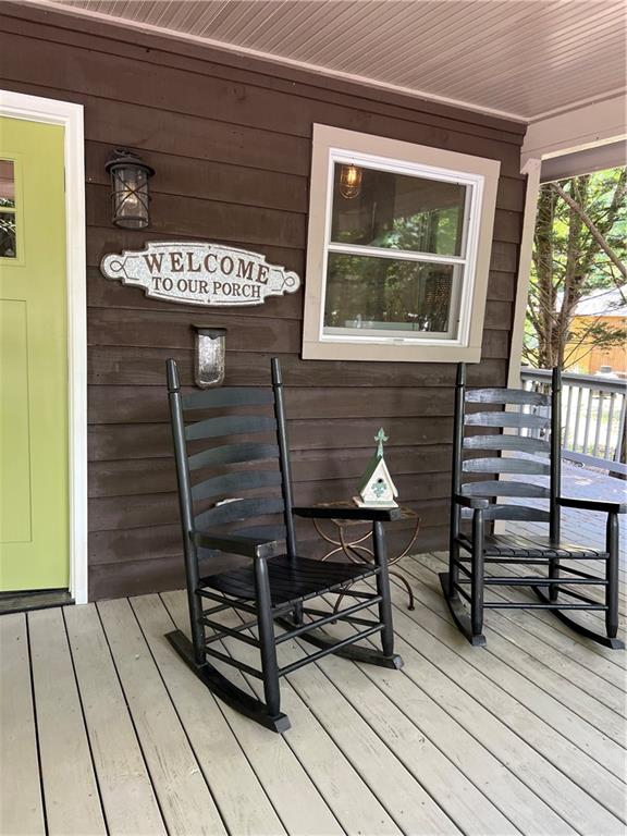 448 Hidden Valley Road Cleveland, GA 30528 - Photo 4 of 12 a view of a chairs setting on the deck