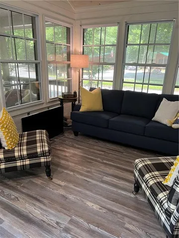 a living room with furniture and windows