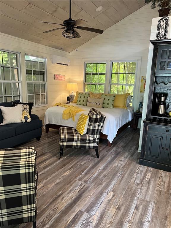 448 Hidden Valley Road Cleveland, GA 30528 - Photo 10 of 12 a spacious bedroom with a bed a couch and large window