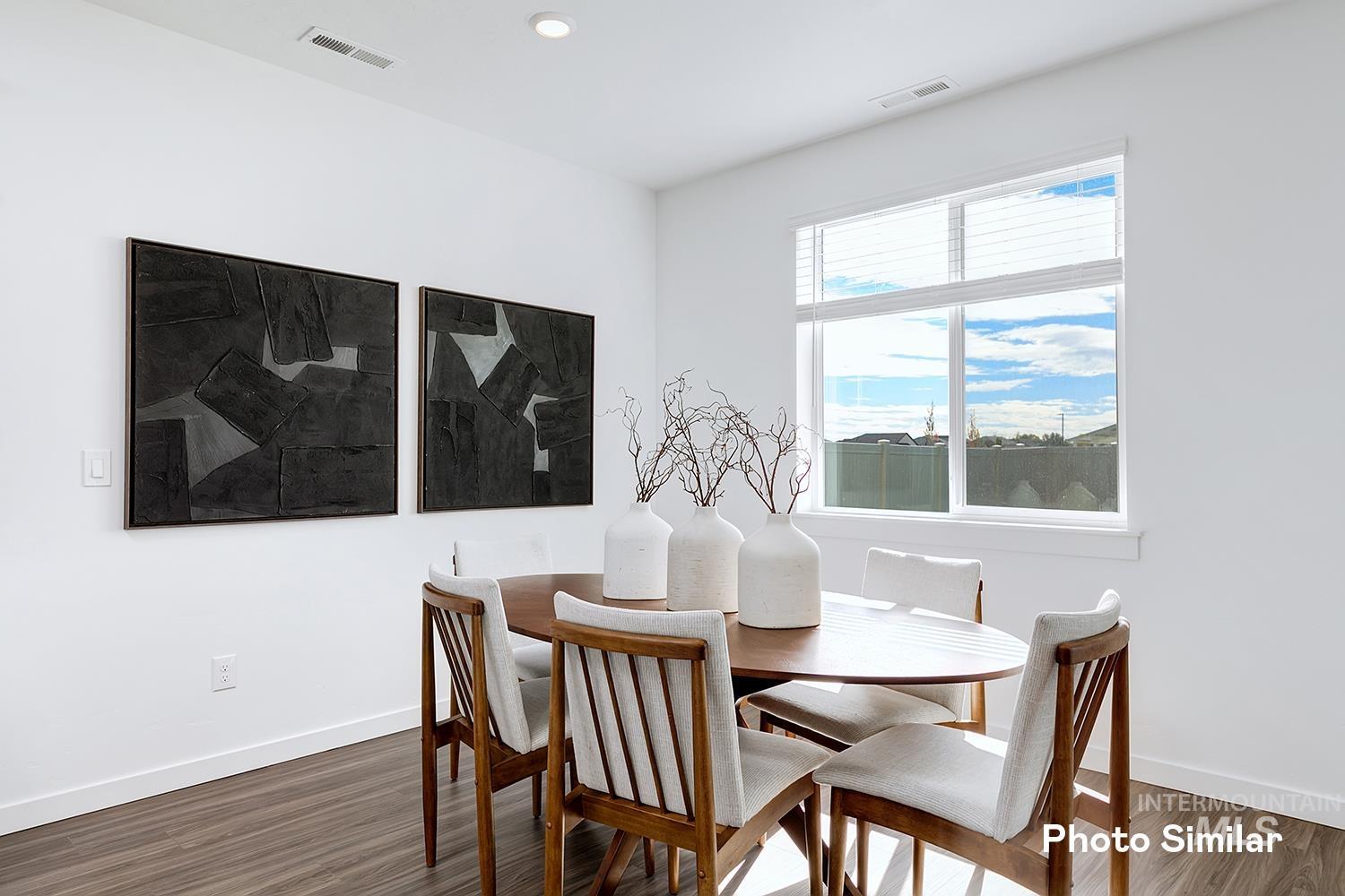 220 Ravello Street Caldwell, ID 83605 - Photo 15 of 35 Dining space featuring wood finished floors and recessed lighting