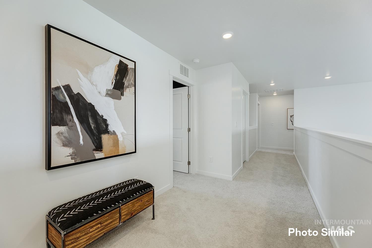 220 Ravello Street Caldwell, ID 83605 - Photo 18 of 35 Hallway with light carpet and recessed lighting