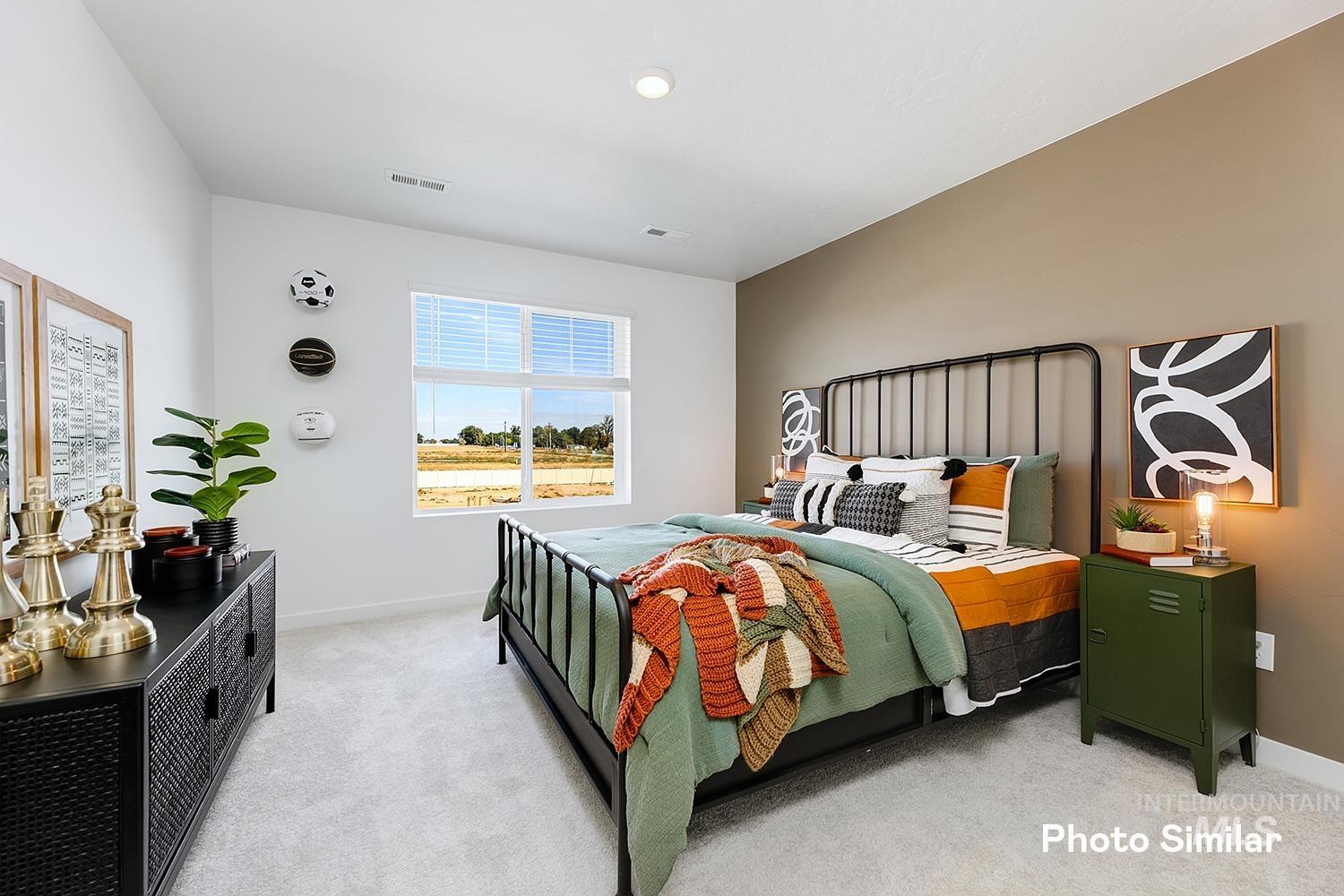 220 Ravello Street Caldwell, ID 83605 - Photo 21 of 35 Bedroom featuring light colored carpet and baseboards