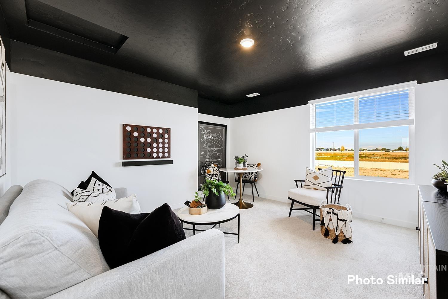 220 Ravello Street Caldwell, ID 83605 - Photo 23 of 35 Living room featuring carpet, a textured ceiling, and recessed lighting