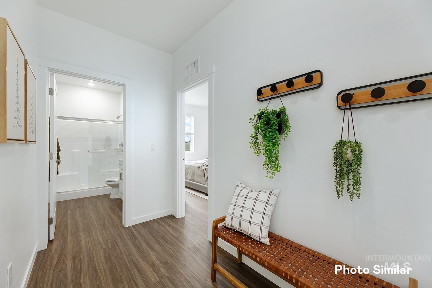 220 Ravello Street Caldwell, ID 83605 - Photo 30 of 35 Hallway with dark wood finished floors and baseboards