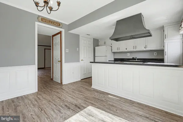 a kitchen with stainless steel appliances a sink and cabinets