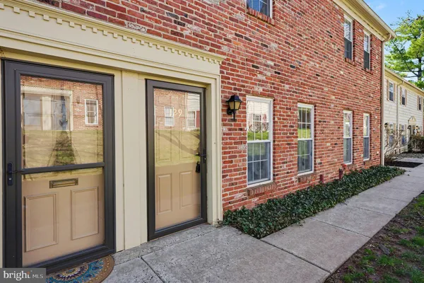 a view of a brick house with a large windows