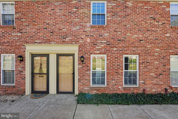 a view of a brick house with a large windows