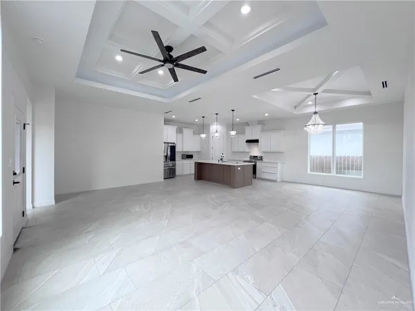 a kitchen with kitchen island a sink stainless steel appliances and cabinets