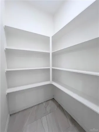 a bathroom with a sink a chandelier and a mirror