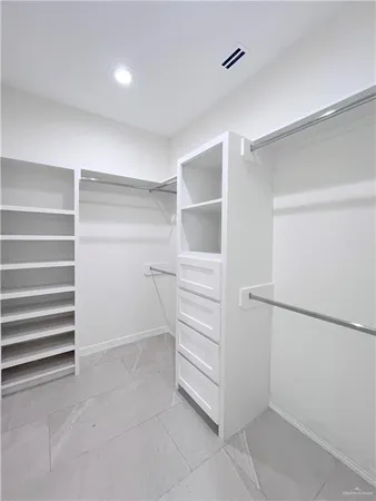 a bathroom with a sink a mirror and shower