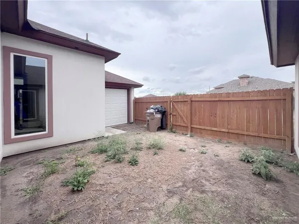 an aerial view of a house with a outdoor space