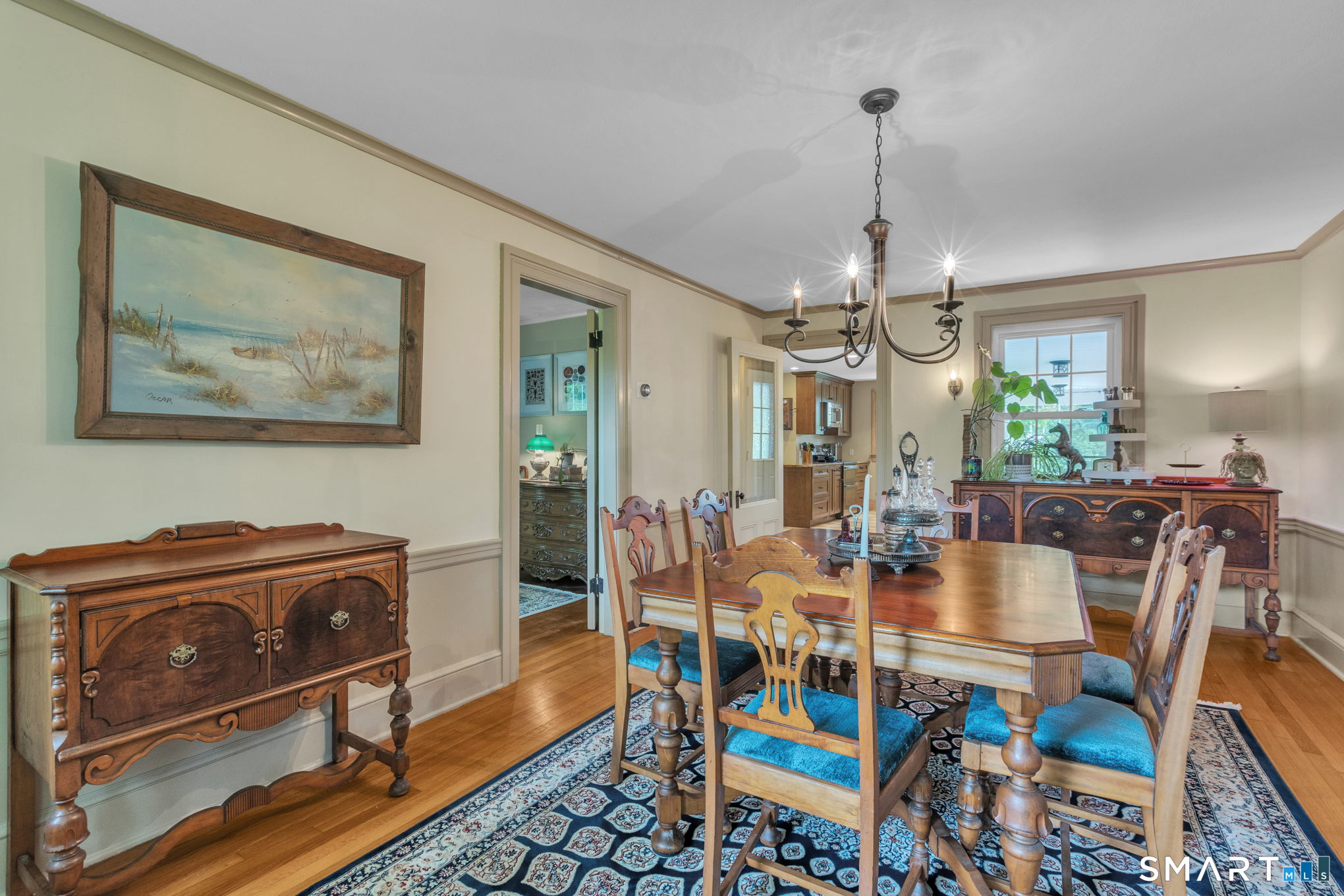 808 Branch Road Suffield, CT 06078 - Photo 12 of 40 a view of a dining room with furniture window and wooden floor